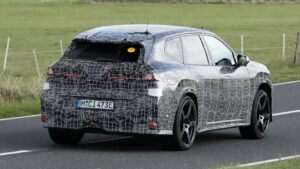 BMW iX3 M - dynamic rear 3/4