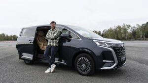 New Denza D9 - Auto Express senior news reporter Alastair Crooks stood next to the Denza D9, front static